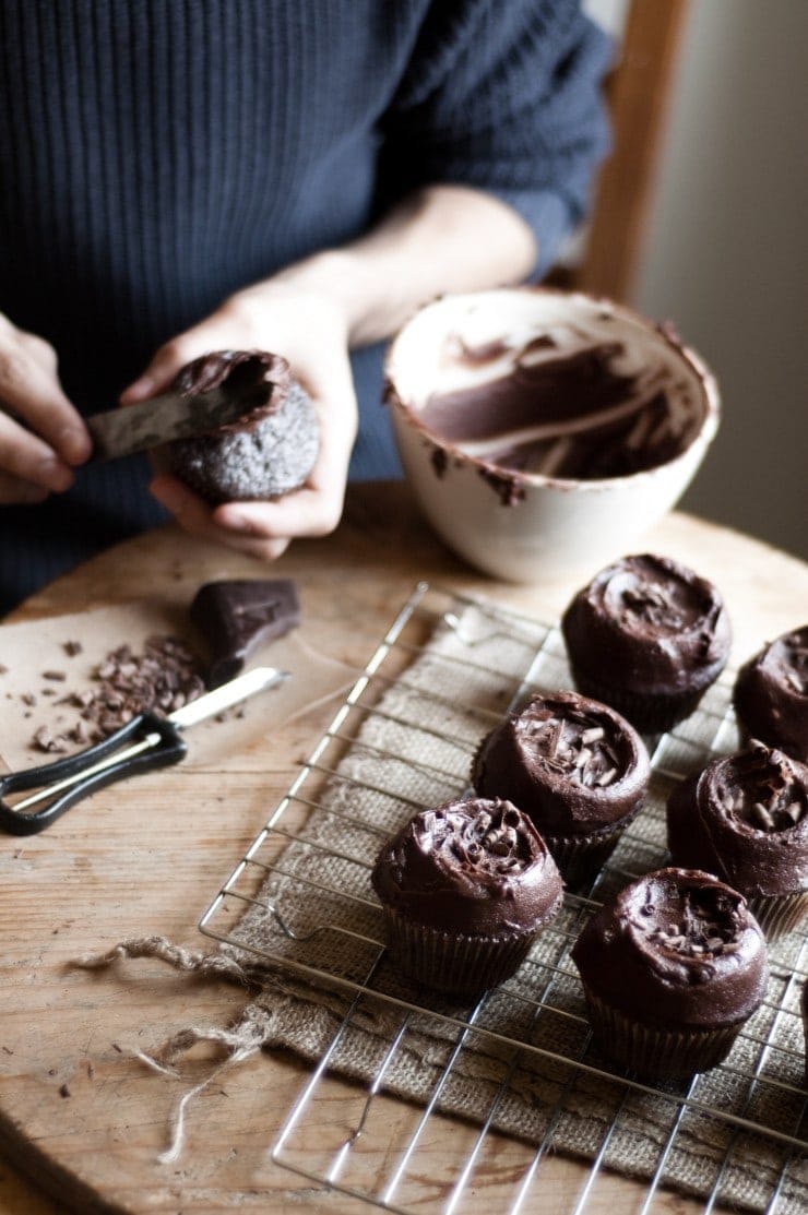 Decorating and frosting a cupcake with chocolate buttercream frosting